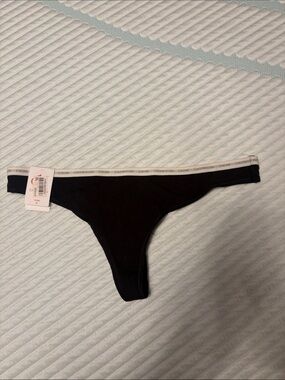 Calvin Klein Black Thong with White Logo Waistband